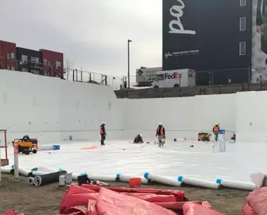 construction workers laying Foundation Waterproofing