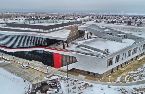 Aerial view of AIMS Welcome Center in snowy landscape