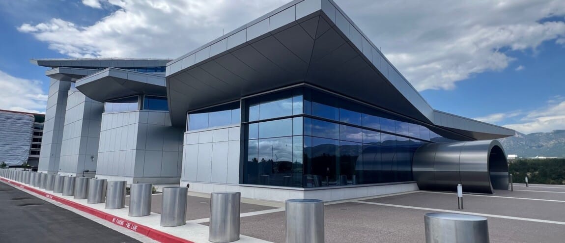 Modern building with large windows under a cloudy sky
