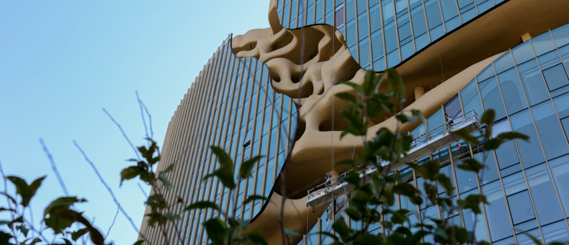 Modern building with unique sculptural facade and glass windows