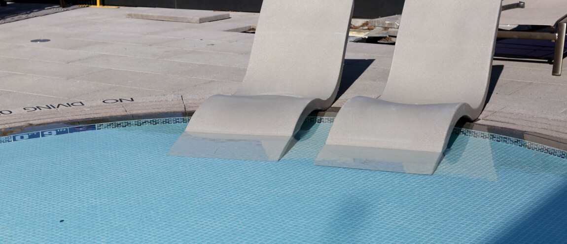 Two poolside lounge chairs with 