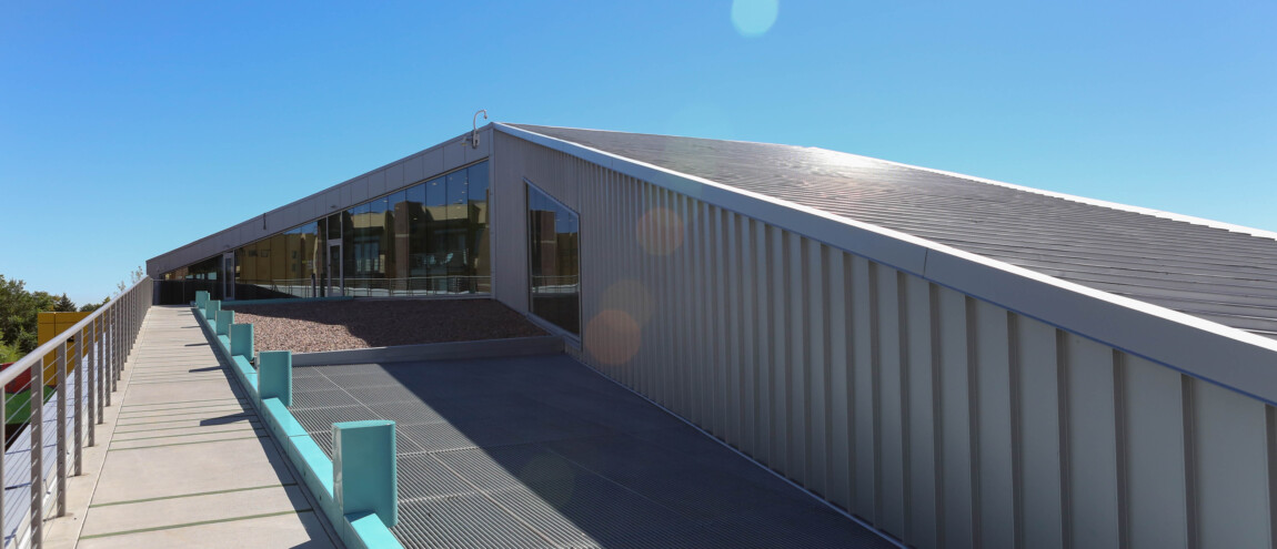 Modern building with metal siding and large windows