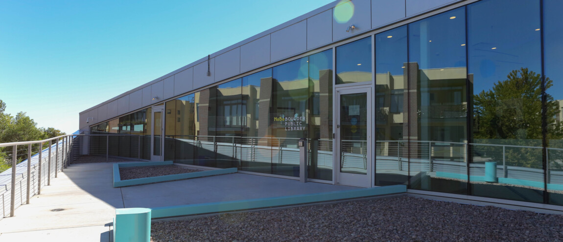 Exterior of NoBo Boulder Public Library with glass facade