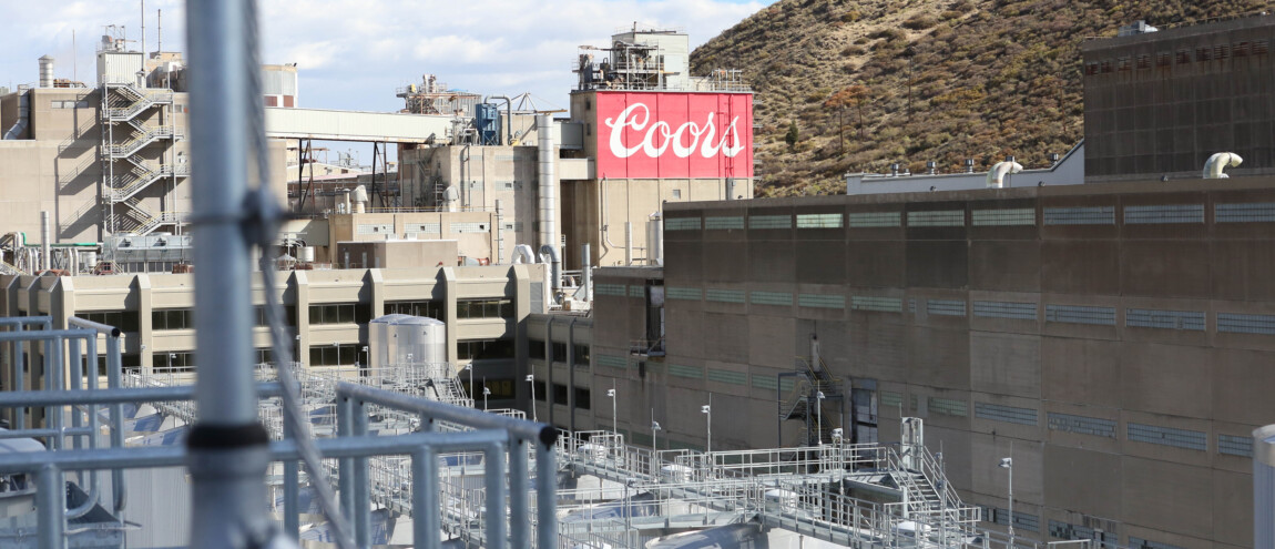 Industrial area with Coors sign and tanks in foreground