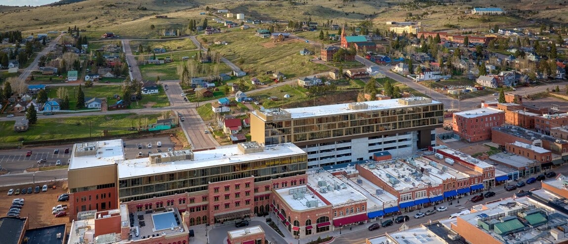 Aerial view of a town with hills and buildings