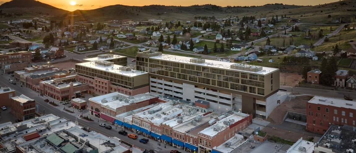 Aerial view of a town and modern buildings at sunset