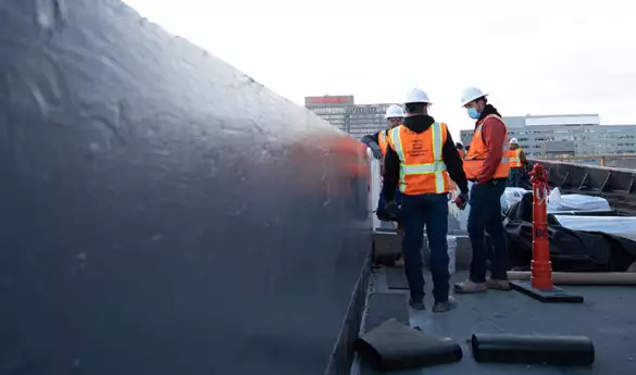 Construction workers doing Waterproofing Coatings