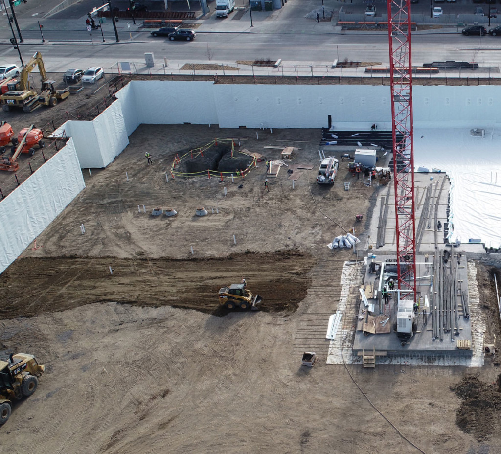 Construction Workers laying Below Grade Waterproofing