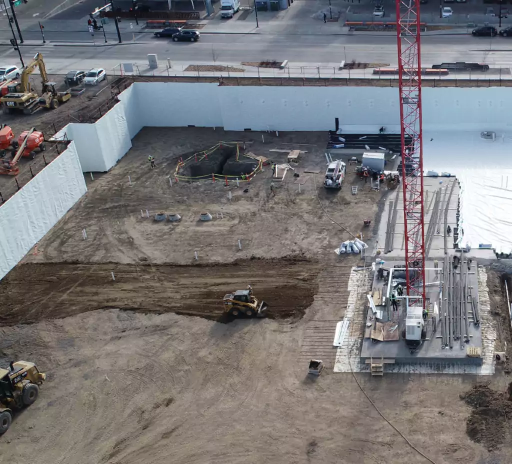 Construction Workers laying Below Grade Waterproofing