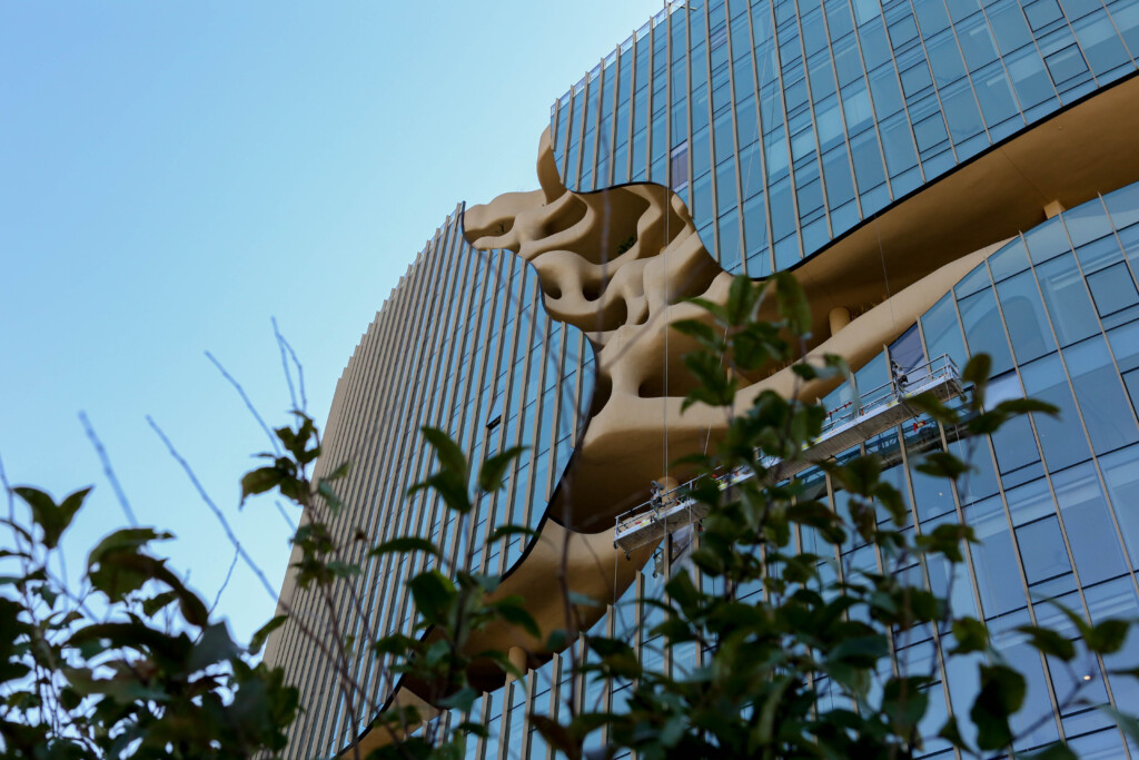 Modern building with unique sculptural facade and glass windows
