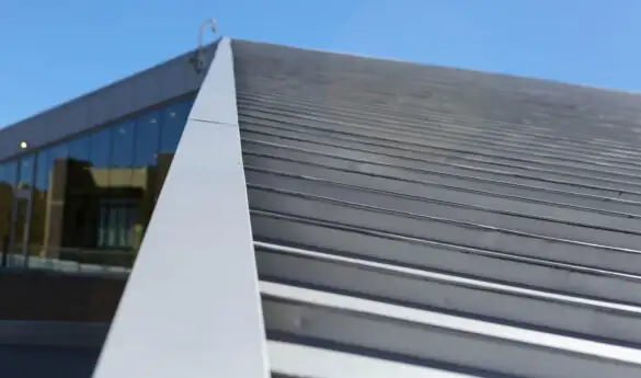 Metallic roof with blue sky in the background