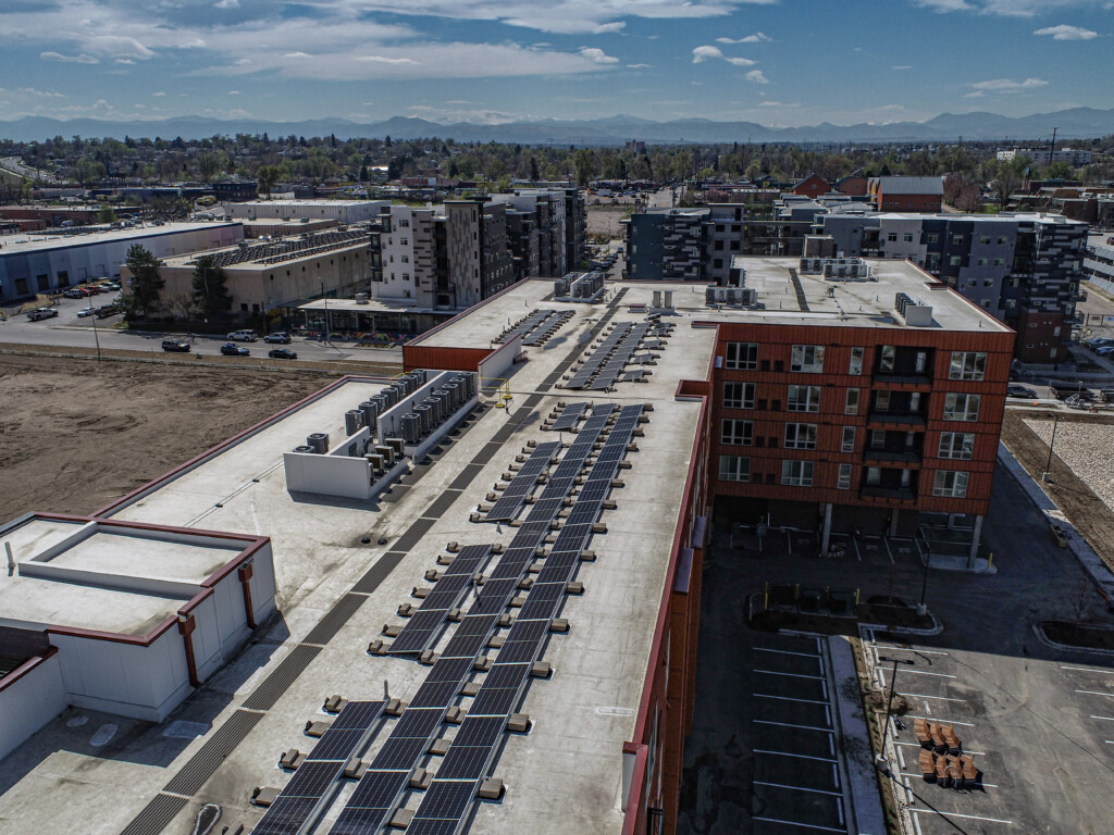 Aerial view of rooftop solar panels on buildings.