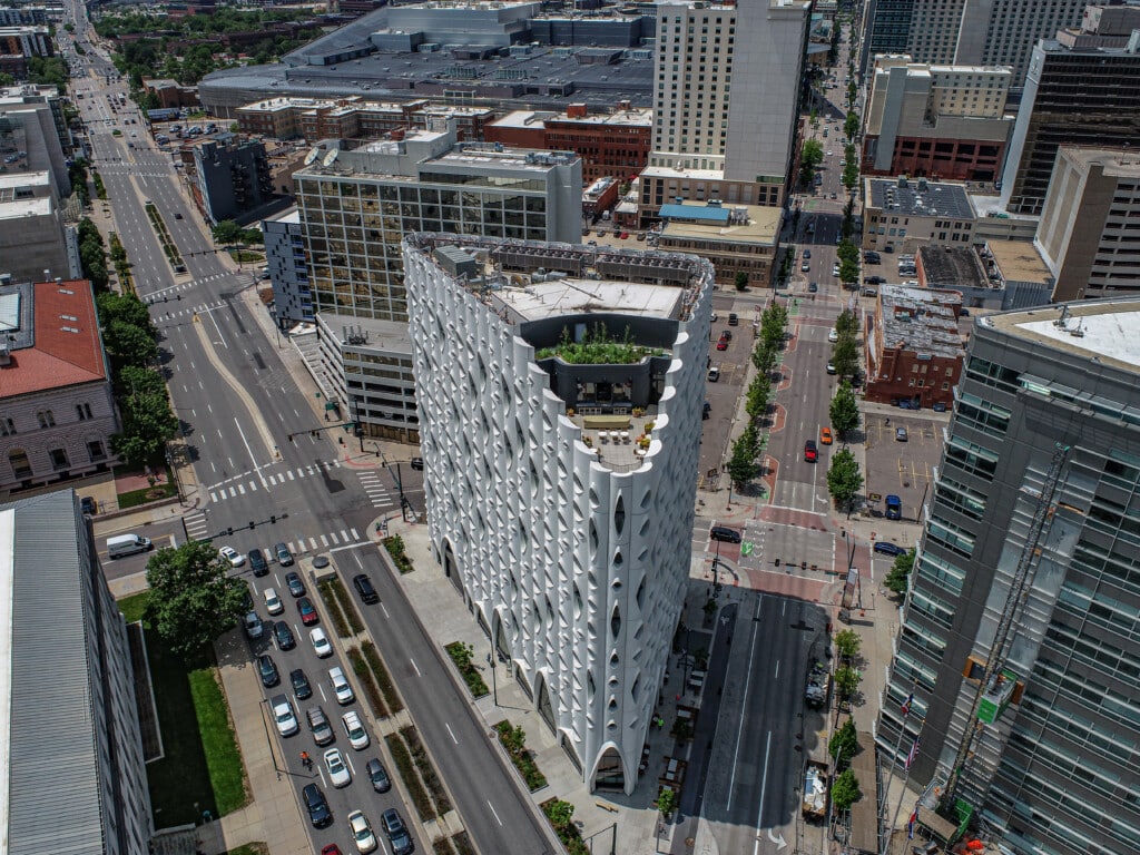Aerial view of a city street and unique building