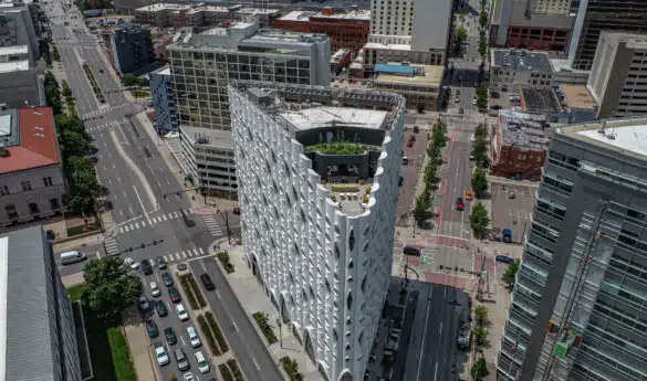 Aerial view of a city street and unique building